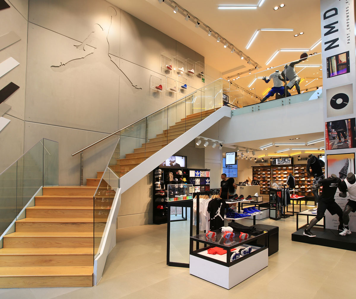 sports apparel storeinterior with stairs and wall-graphics