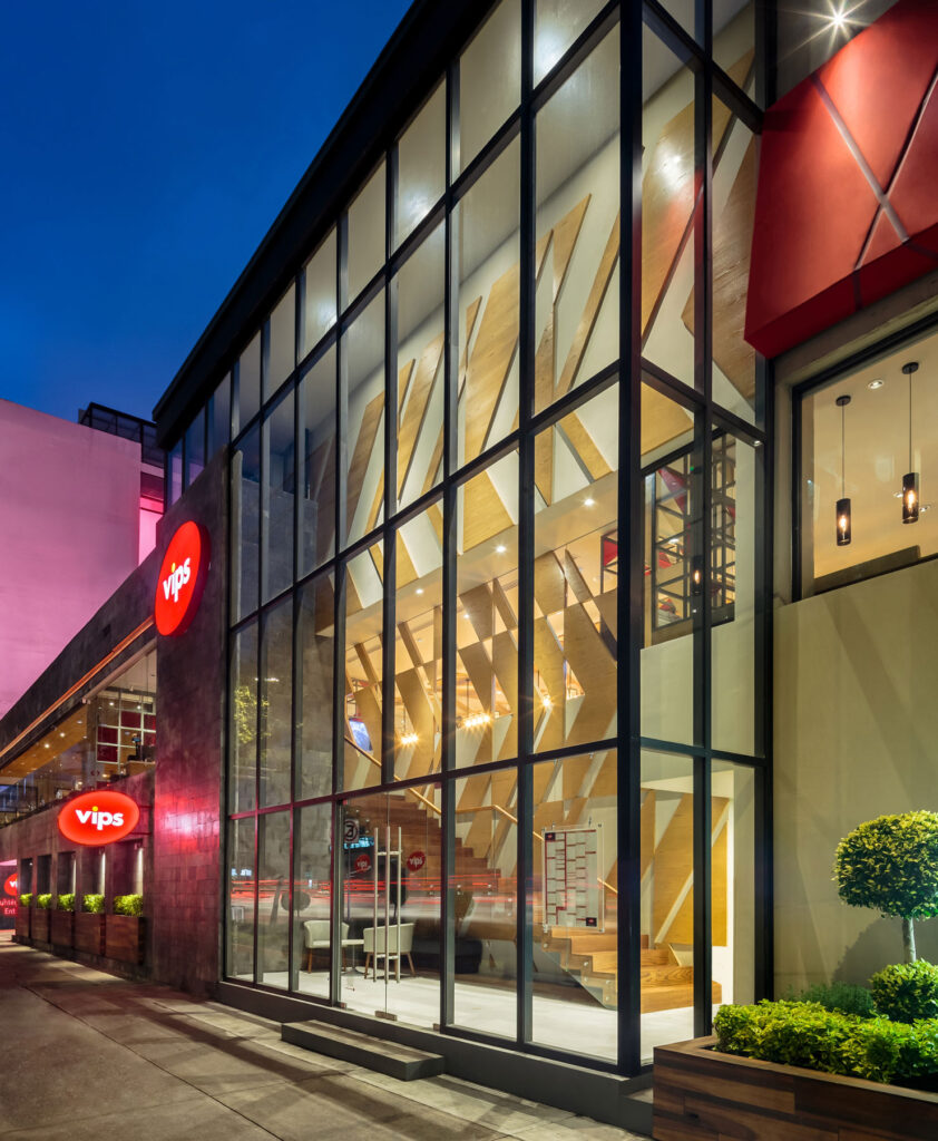 Exterior of restaurant with high glass windows